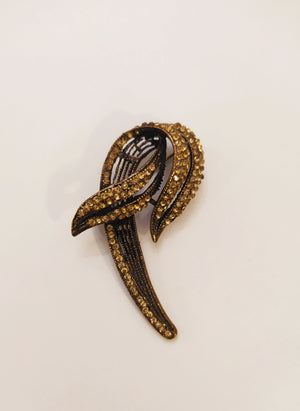 Broche pétalo dorado